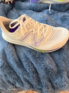 New Balance Women’s White Athletic Running Shoe with Purple Accents